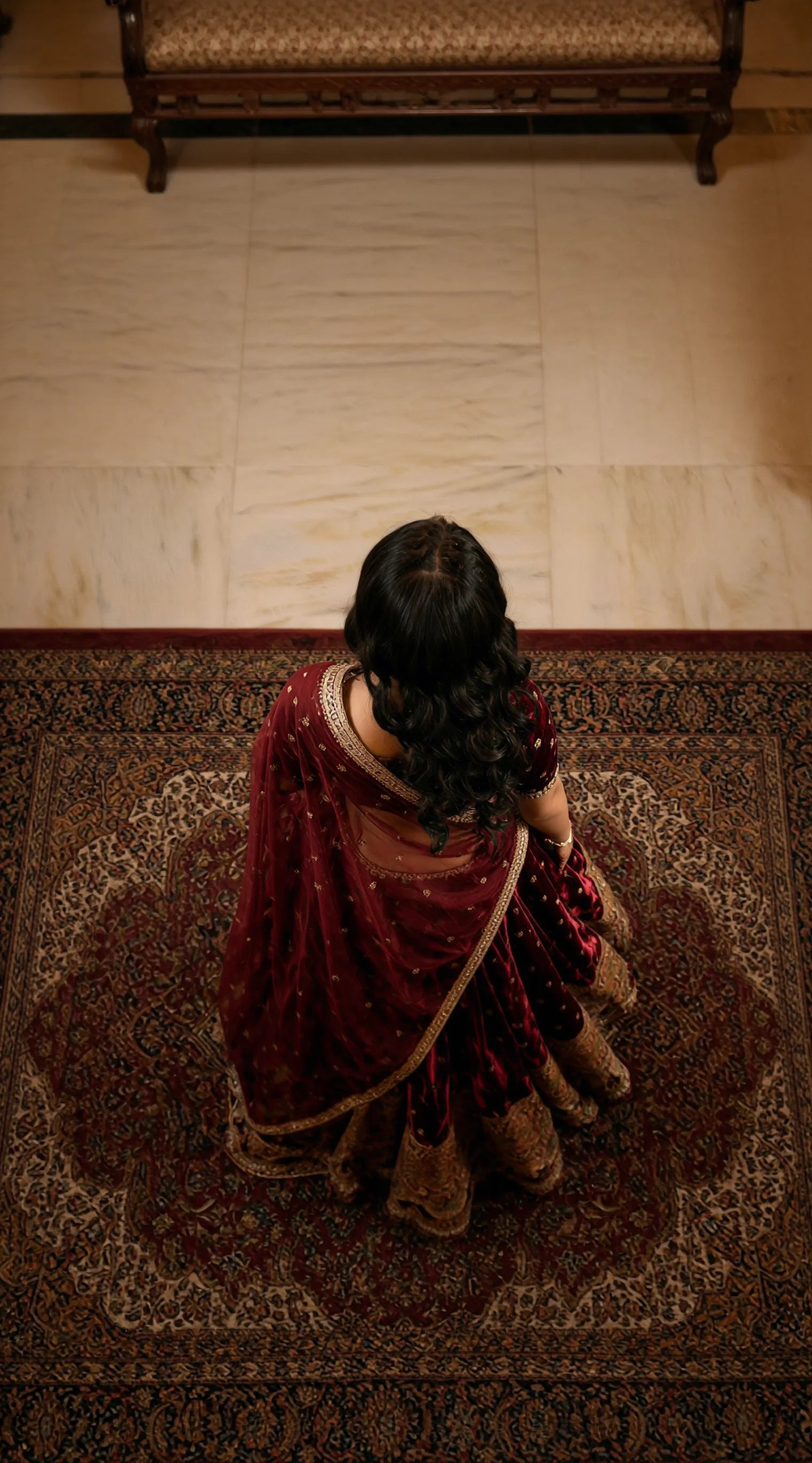 Designer Velvet Lehenga Set in deep maroon tone with traditional gold embroidery accents.